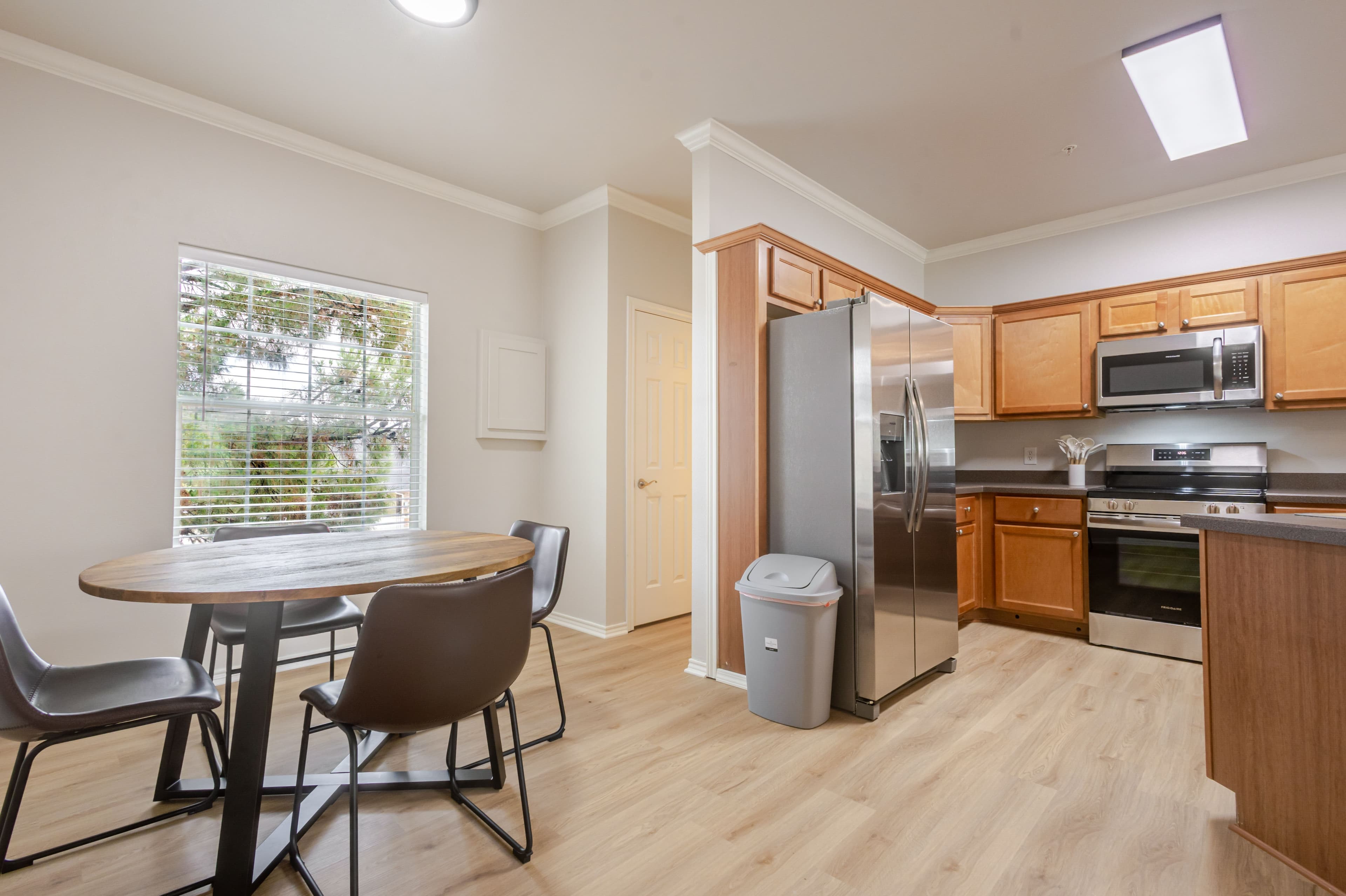 Interior shot of dining area and kitchen of lubbock airbnb condo