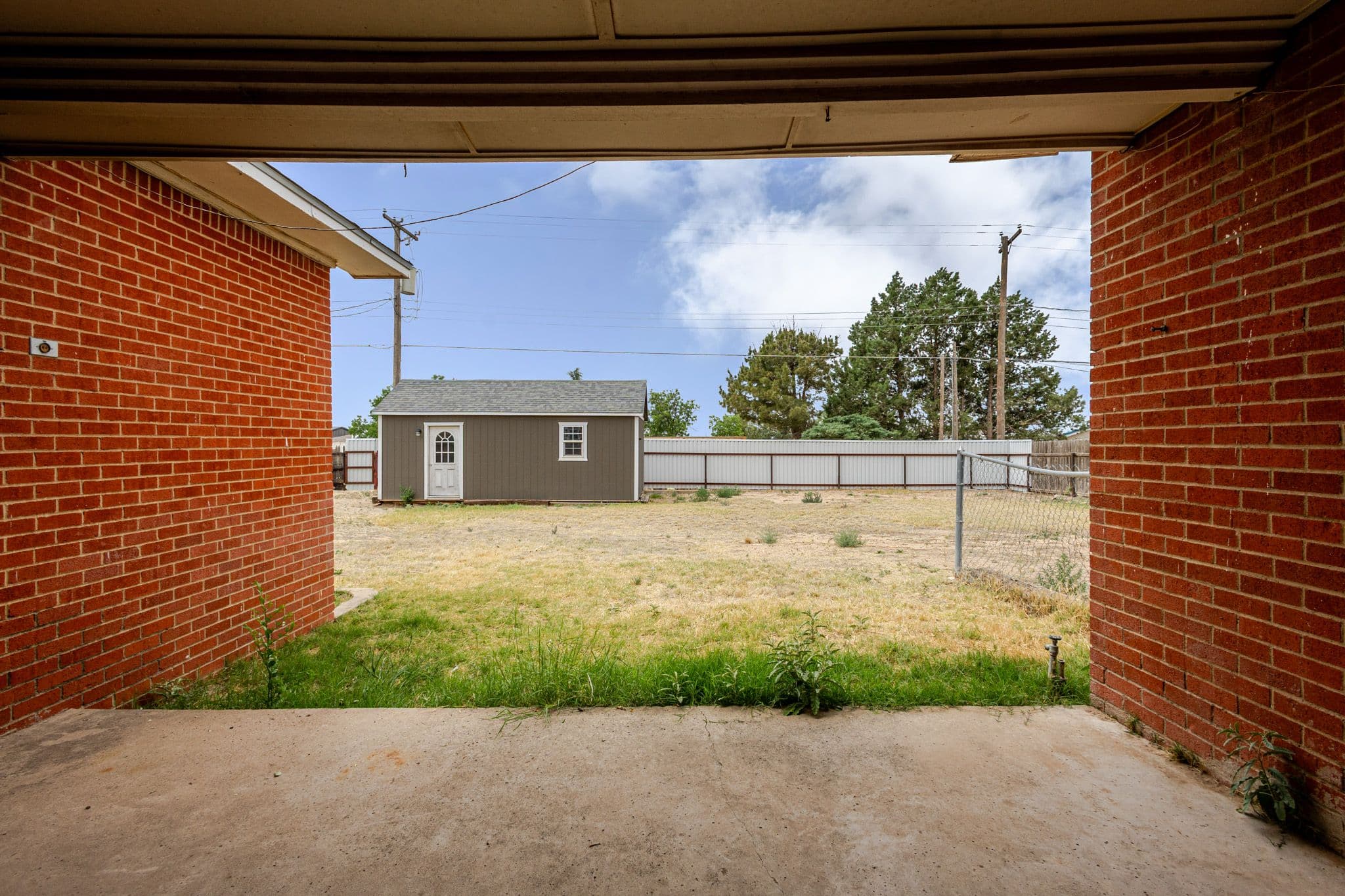 Exterior shot of back porch facing backyard