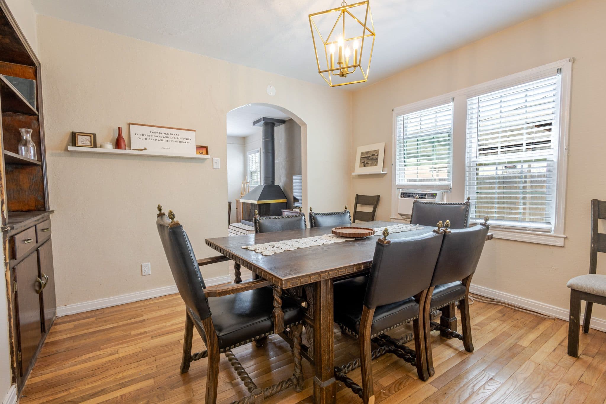 Interior corner shot of dining room with window view. Airbnb located in Clovis New Mexico.