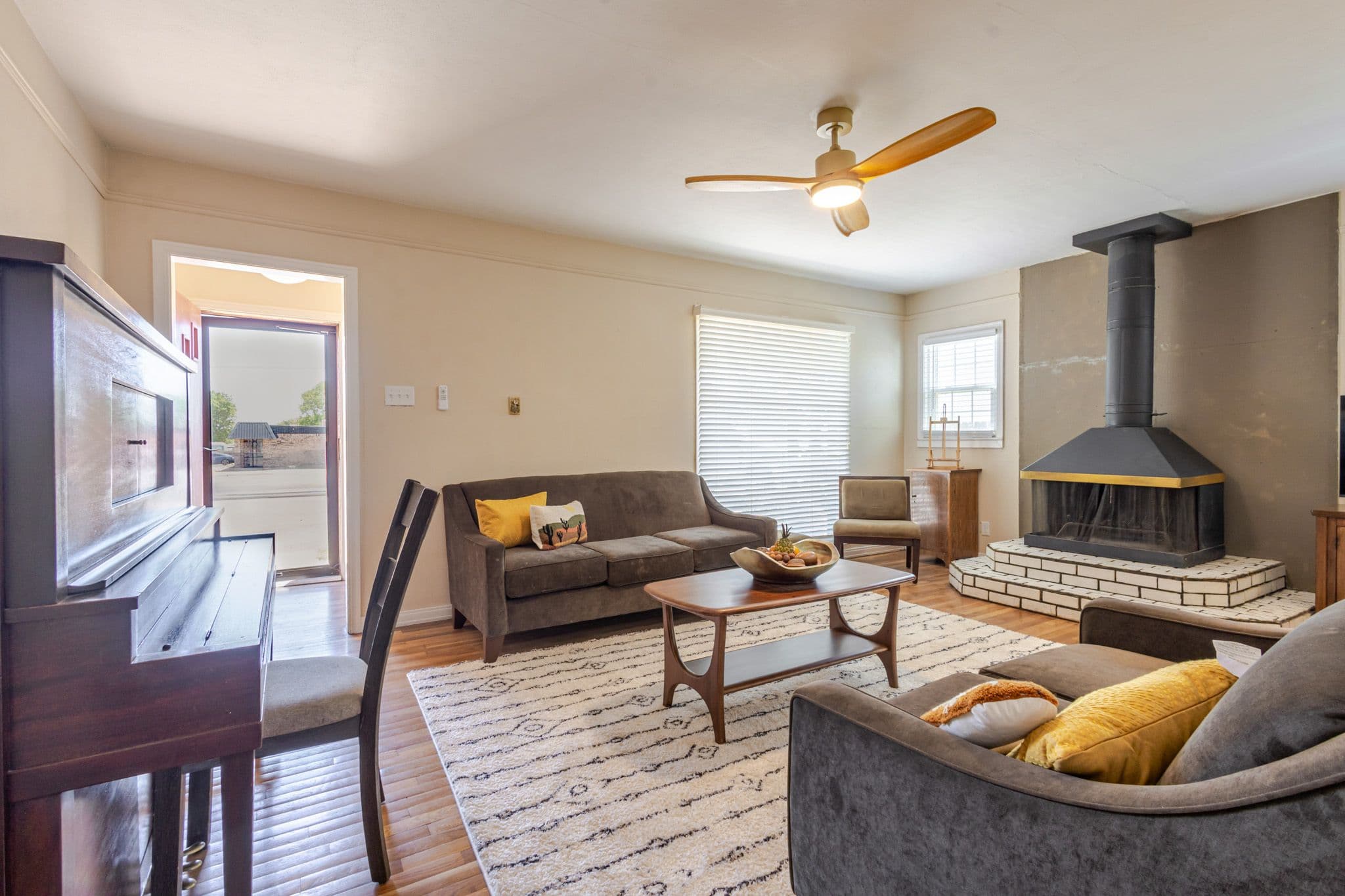 Interior shot of living room facing the front door. Front door is in view of the street.
