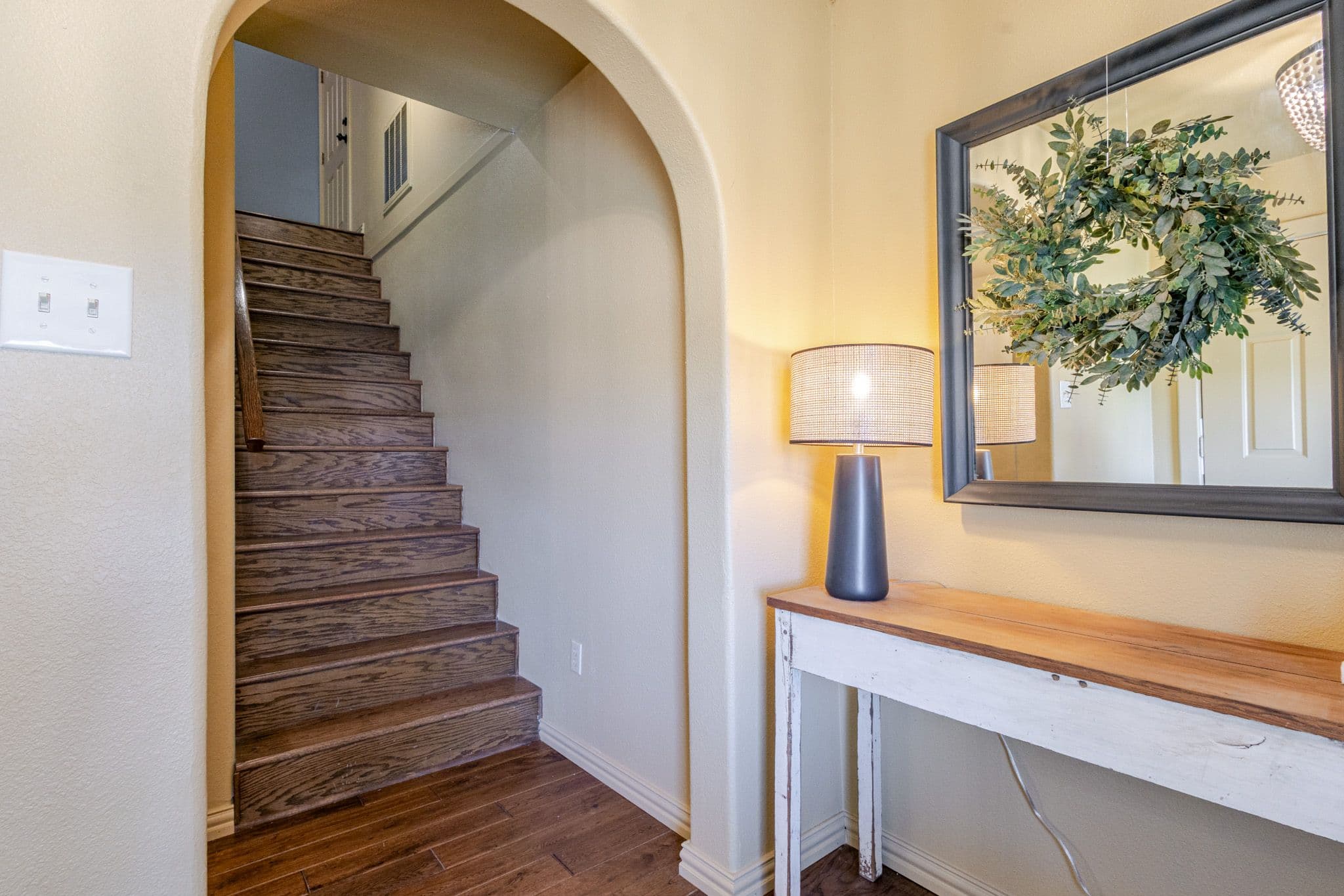 Interior shot of foyer with stairs reveal in background
