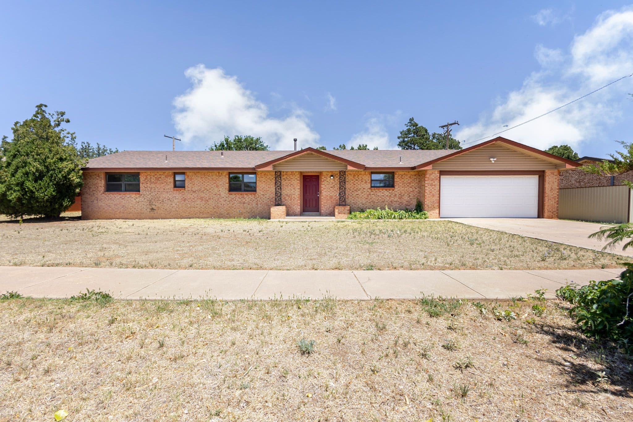 Exterior shot of brick home located in Clovis NM.