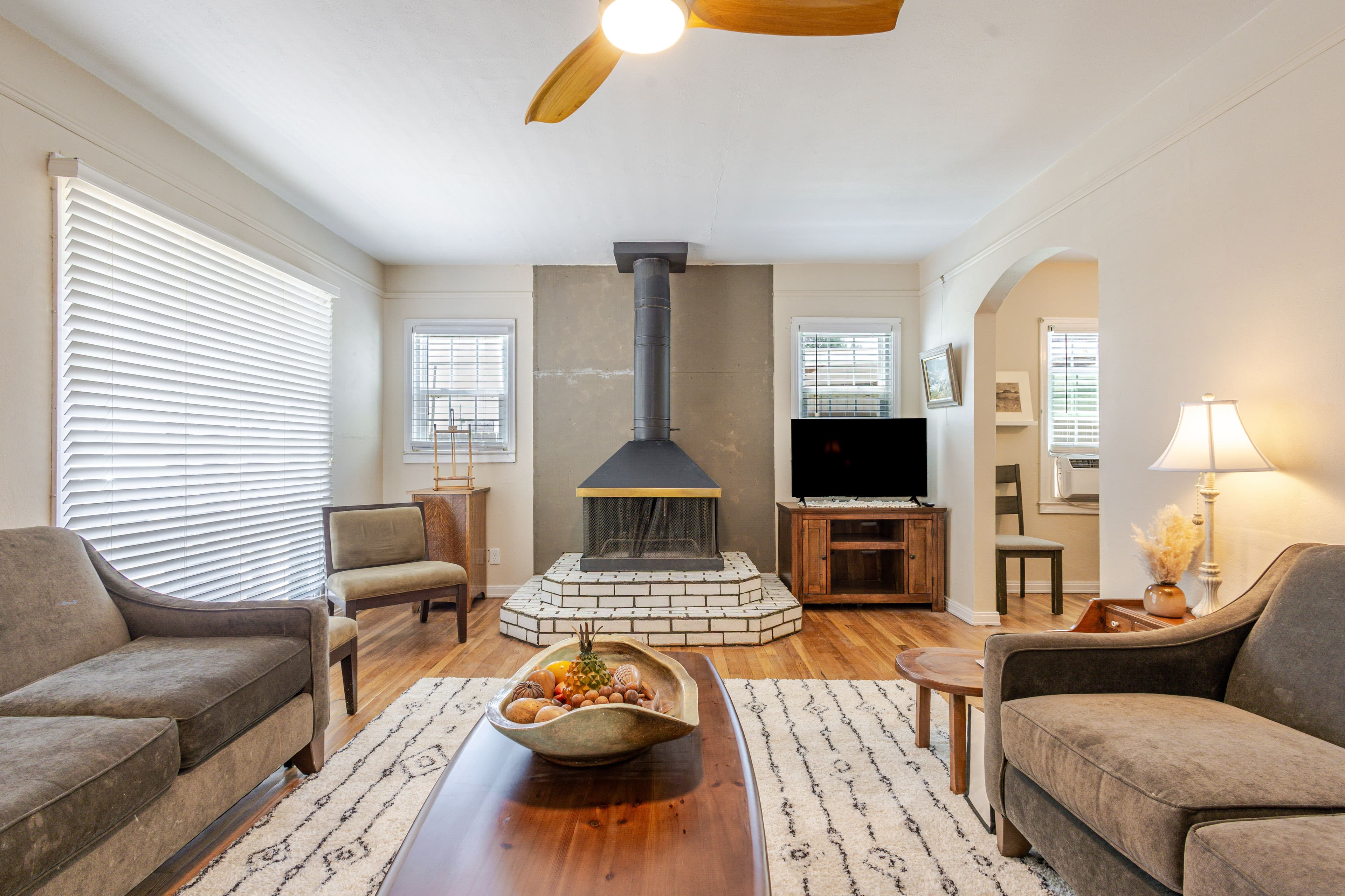 Interior center shot of living room facing the fireplace. Airbnb located in Clovis, New Mexico.